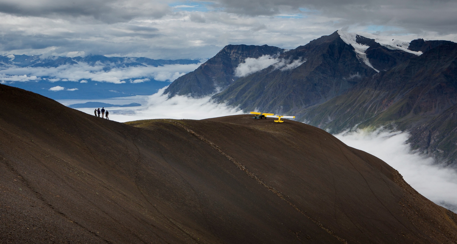 Guests of Ultima Thule Visiting a High Mountain Bluff By Bush Plane