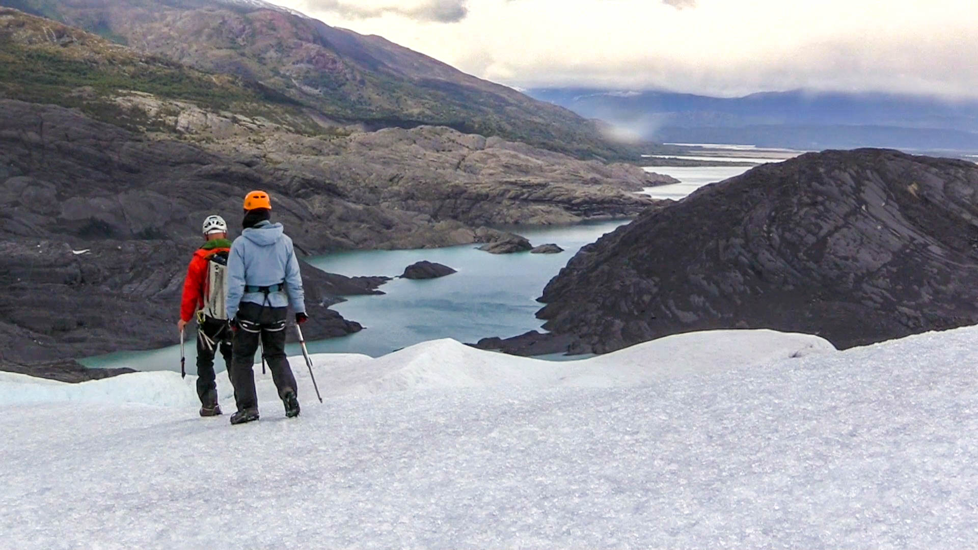 A couple hikes atop a glacier.