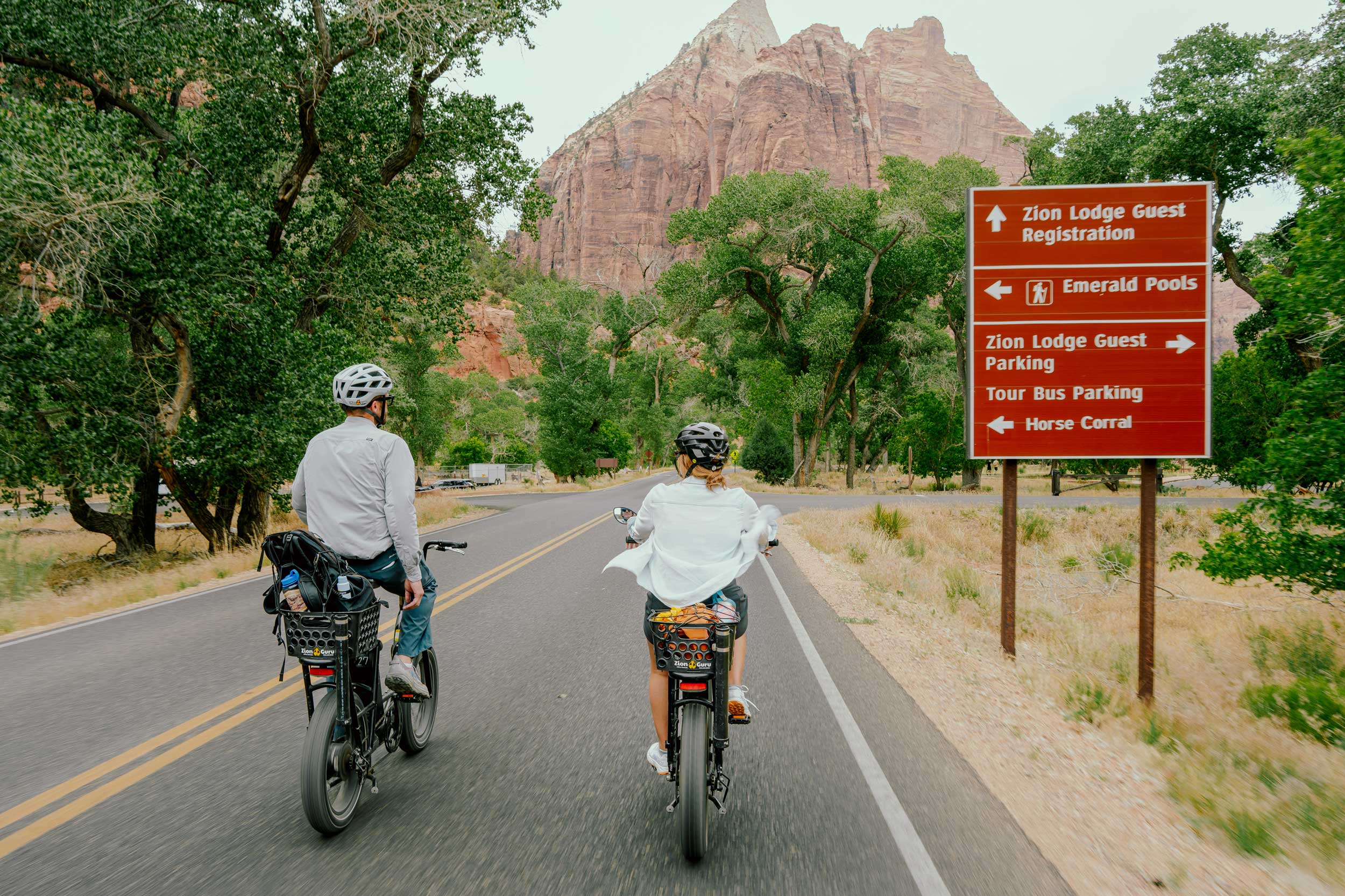 Friends e-bike through Zion.