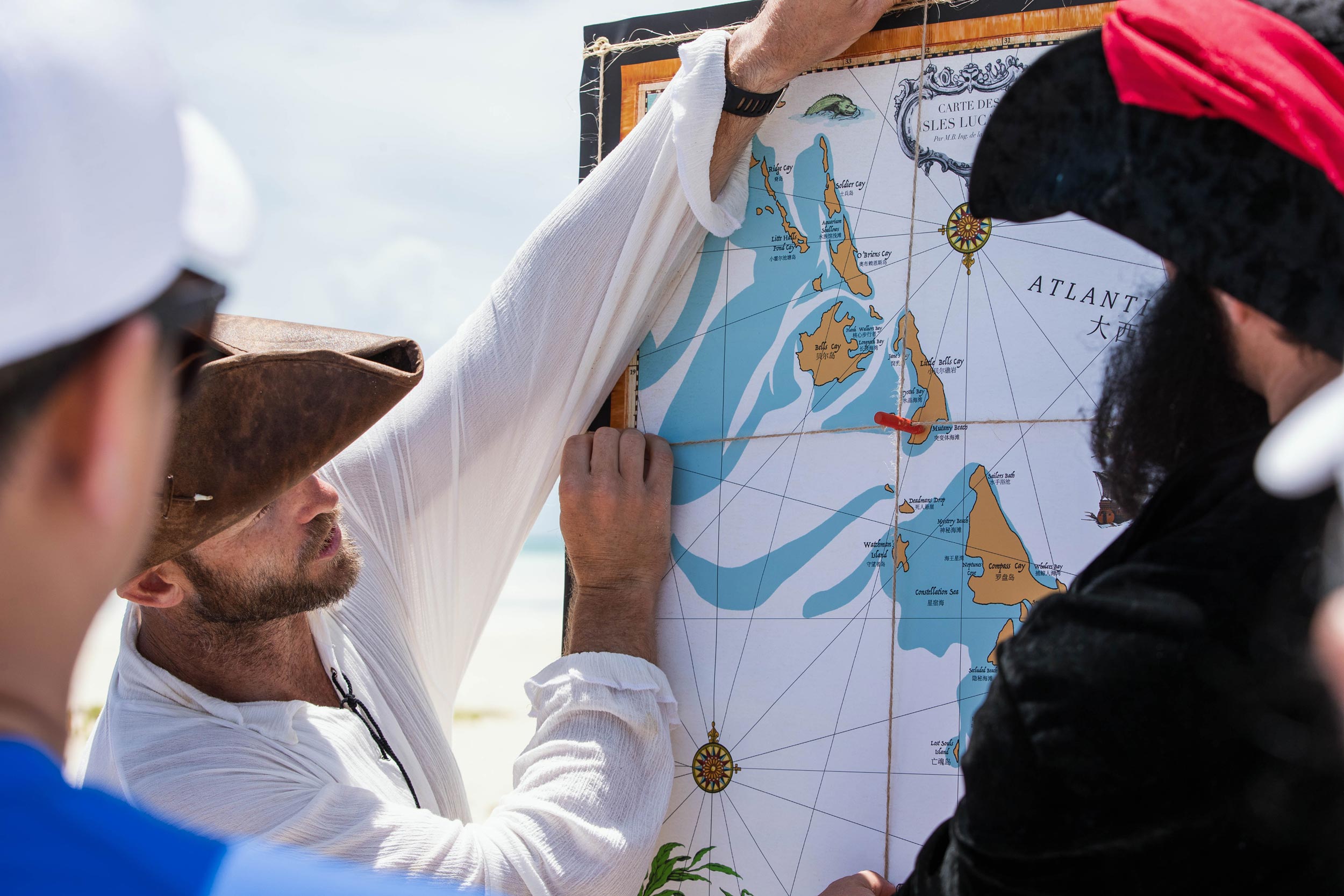 - EXP Journeys A team assesses a map used to complete their team challenge in Nassau.