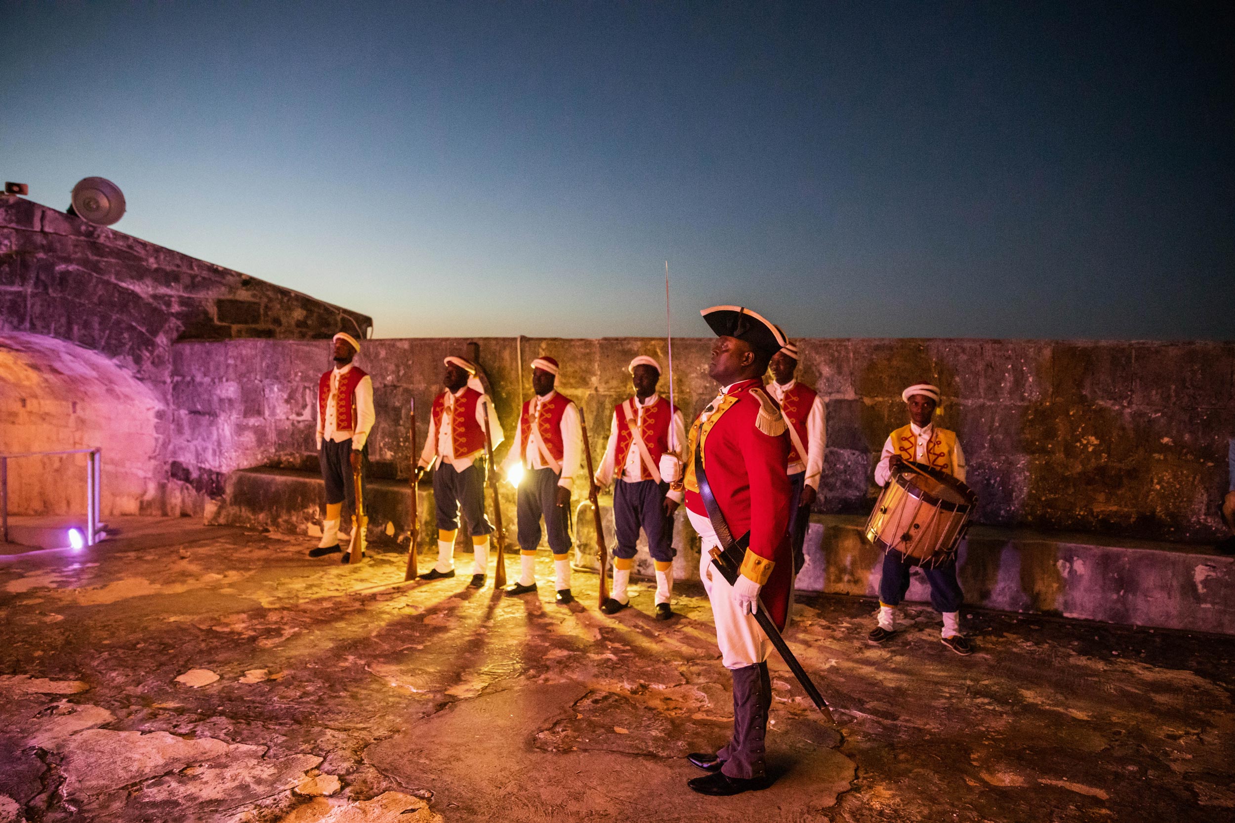 - EXP Journeys Soldiers stand at attention during an immersive, private dinner in Nassau.