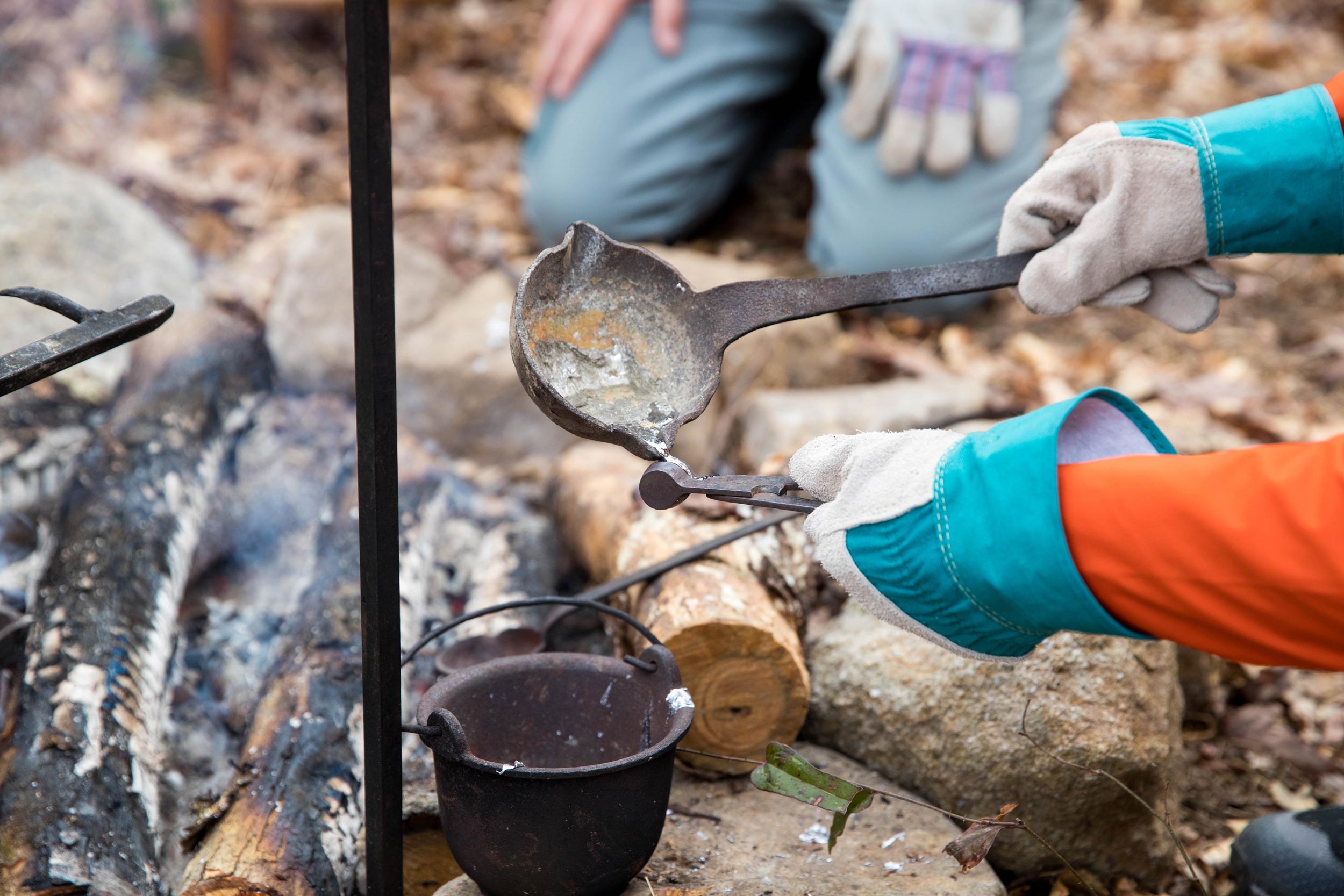 - EXP Journeys Musket balls are made over a fire with metal tools and a mold.