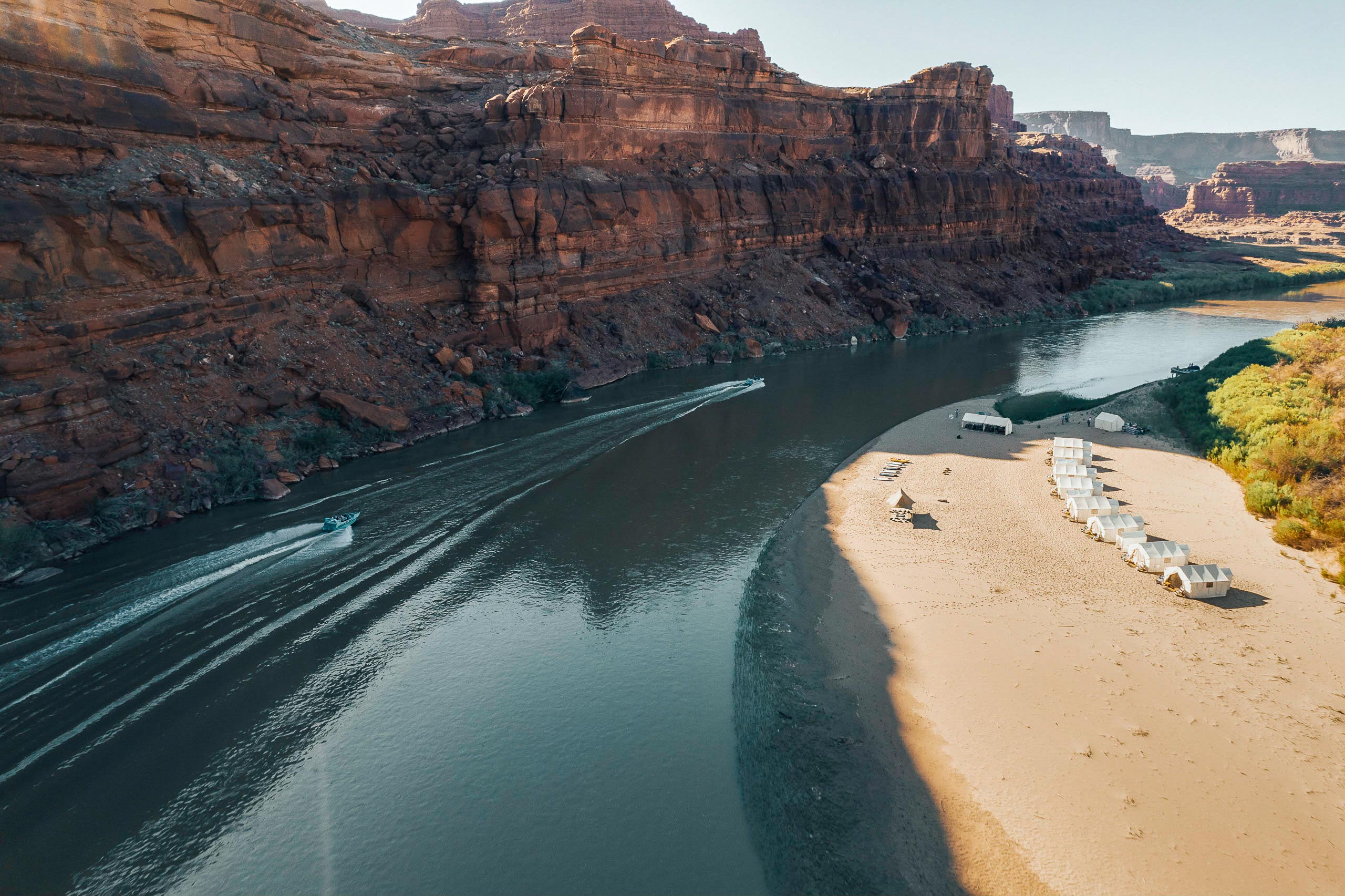 Boats arrive to a private luxury camp on the Colorado River.
