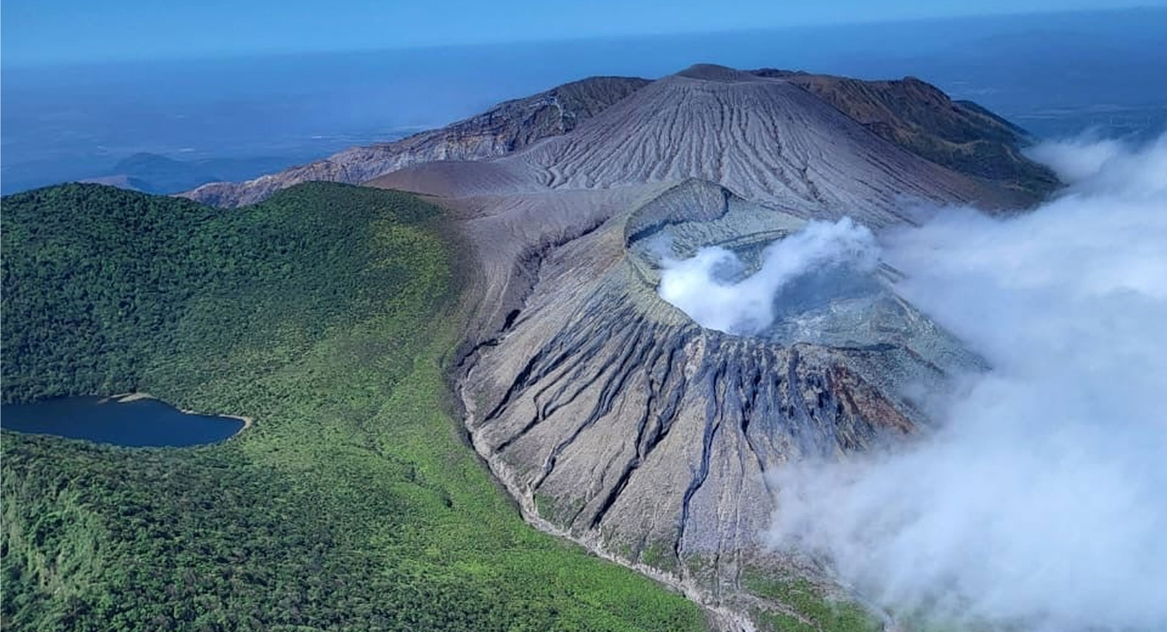 costa-rica-welcome-to-turrialba A majestic aerial shot of the Turrialba Volcano's smoking craters, showcasing the diverse volcanic landscapes of Costa Rica.